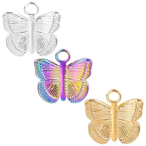 Butterfly pendant set in silver, rainbow gradient, and gold stainless steel finishes