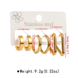 Macro detail of gold geometric stainless steel earring set including hoops and rectangles