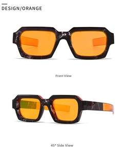 Makrodetail des Marmormuster-Rahmens mit leuchtend orange getönten Gläsern