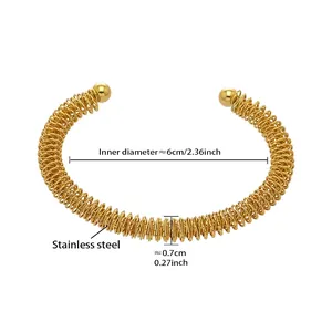 Detailed view of golden stainless steel spiral bangle with size dimensions and measurements