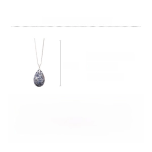 Close-up of teardrop-shaped natural stone pendant with a long silver alloy chain