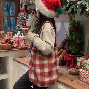 Classic red and beige plaid tote bag styled in a festive Christmas themed setting