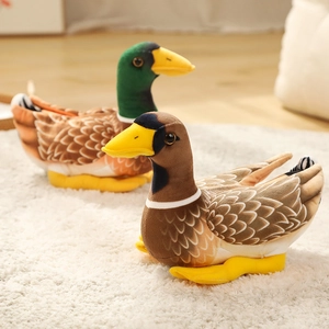 Realistic mallard duck plush toys with textured brown feathers on a soft white carpet