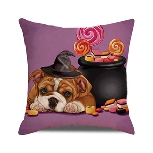 Detail of Halloween bulldog pillow cover showing vibrant witch hat and candy bucket design