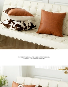 Close-up of brown PU leather and cow print faux fur pillows on a white chair