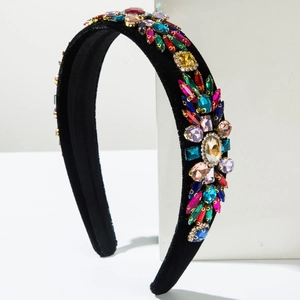 Close-up of velvet headband with colorful rhinestones and geometric crystals for parties