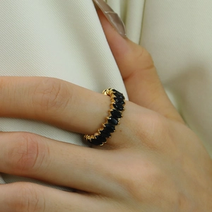 18k gold plated titanium steel ring with marquise cut black stones worn on finger