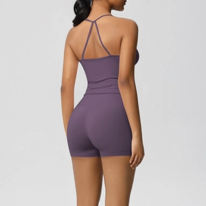 Back view of a purple yoga set showing high-waisted shorts and a Y-back strappy top