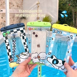 Waterproof phone pouches with cartoon designs and lanyards shown by a pool
