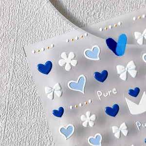 5D embossed nail stickers featuring blue hearts and white floral motifs for 3D nail art