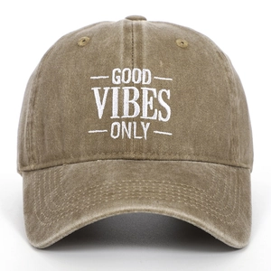 Detail of embroidered Good Vibes Only text on a vintage washed cotton baseball cap