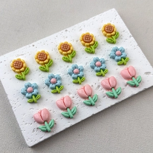 Glossy resin flower charms set with sunflowers, tulips, and daisies for DIY crafts