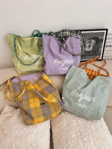 Collection of large canvas tote bags in pastel green, purple, blue and plaid patterns