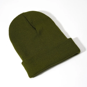 Close-up of olive green ribbed knit beanie showing high-quality cuff detail and texture