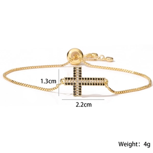 Bracelet en cuivre plaqué or 18 carats avec pendentif croix en zircons noirs et clairs