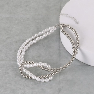 Detail of double-layer necklace with faux pearls, silver beads and adjustable metal clasp