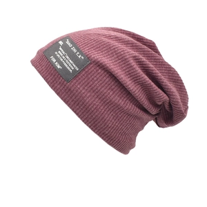 Women's warm dark purple knitted slouchy beanie hat with vintage ribbed texture
