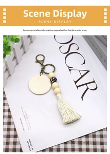 Detail view of Nordic keychain with wood beads, leopard bead, and cotton tassel
