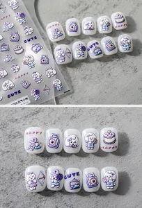 Detailed 3D embossed nail art stickers with cute cartoon puppy and camera patterns
