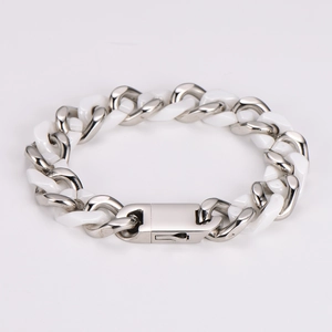 Macro detail of alternating white ceramic and silver metal links with a secure folding clasp