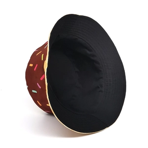 Reversible bucket hat with creative donut print and black solid side for sun protection