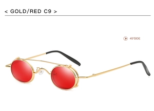 Side view of retro punk gold frame sunglasses with flip-up red lenses at 45-degree angle