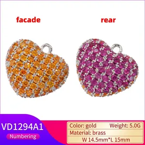 Luxurious gold heart bone pendant with vibrant zircons showing front and back views