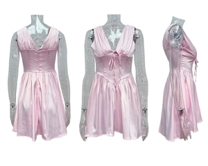 Detailed views of a pink satin mini dress featuring a deep V-neck and a cinched waist design