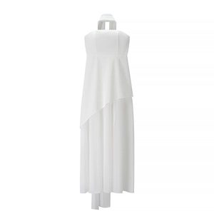 Detailed view of the layered asymmetrical chiffon hem on white tube neck maxi dress