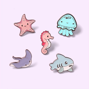 Set of 5 cute cartoon marine life enamel pins featuring a starfish, seahorse, and jellyfish