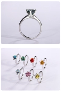 Detailed close-up of colorful round-cut moissanite stones in classic six-prong silver rings