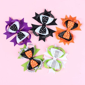 Detailed set of 5 colorful Halloween glitter hair bows with polka dots on pink background
