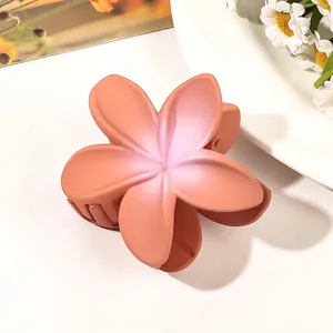 Matte orange-pink gradient plumeria flower hair claw clip with durable metal spring