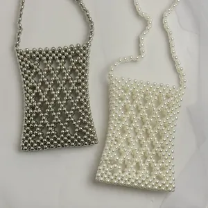 Detail showing handcrafted pearl and silver bead woven crossbody bags with lattice texture