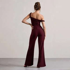 Detail of burgundy one-shoulder backless jumpsuit with wide-leg cut on model