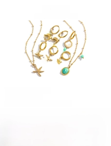 Detailed macro view of 14K gold plated starfish and dolphin jewelry set with amazonite