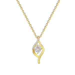 Macro shot of gold-plated teardrop pendant with clear central stone and side accents