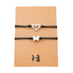Close-up of butterfly charm bracelets on a sentimental Mother and Daughter gift card