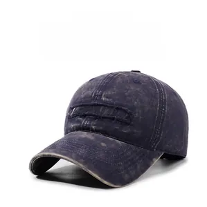 Detail of vintage navy blue washed denim baseball cap with embroidered letter patch