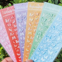Detailed view of colorful butterfly stickers for journaling in soft pastel macaron colors