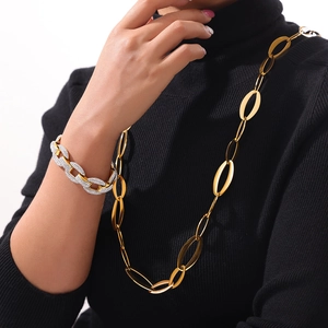 French vintage titanium steel jewelry set featuring a gold chain and diamond bracelet
