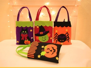 Detailed view of Halloween felt gift bags featuring black cat, witch, spider and pumpkin designs