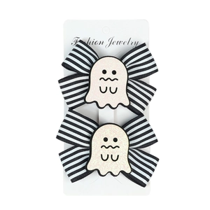 Halloween girls hair clips set with black white striped bows and glittery pink ghosts