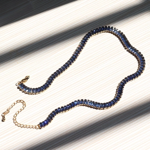 Rainbow tennis necklace with blue zircons in gold setting and lobster clasp closure