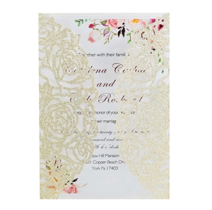 Close-up of laser-cut gold glitter rose wedding invitation with elegant typography