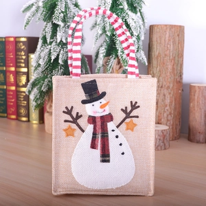 Sac cadeau de Noël en toile de jute avec motif bonhomme de neige et anses rayées