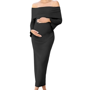 Elegant off-shoulder black knit maternity maxi dress featuring a slim fit silhouette