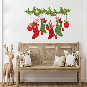 Detailed wall sticker layout featuring festive red stockings, holly, and candy canes