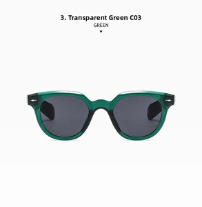 Detail of transparent green sunglasses with silver arrow rivets and dark gray lenses
