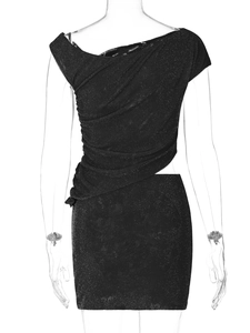 Detail of glitter black backless dress with irregular cutouts and shimmery fabric